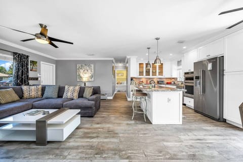 The perfect family room to read, play and enjoy. The living room is open and spacious. Enjoy the 55" TV with cable and smart apps. The room is perfectly located with easy access to all spaces in the home. The large windows bring in ample lighting.