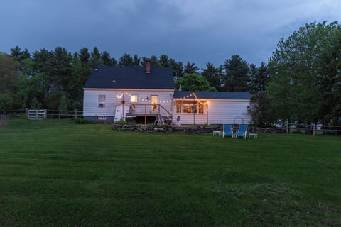 🌌 Spacious yard with string lights and cozy night vibes! ✨🏡  
