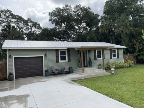 Front of Home with one car garage and long driveway