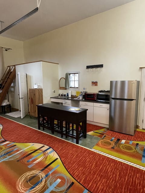 Converted RV has bathroom and kitchenette area, single shared sink