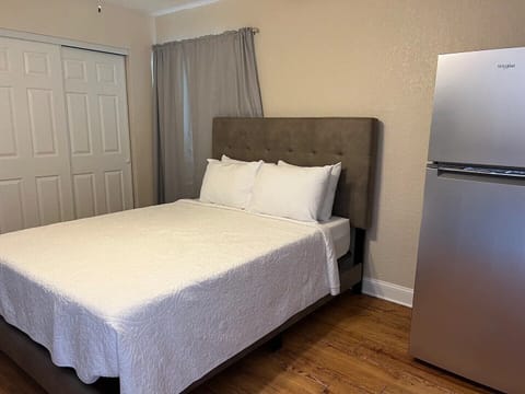 Queen sized bed with premium mattress and bed linens.