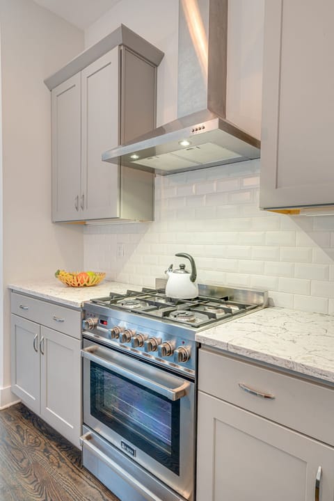 Fully equipped kitchen stocked with your basic cooking essentials complete with breakfast bar seating.