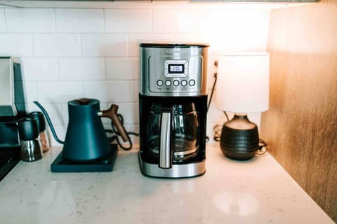 Fuel your day: this kitchen is a coffee lover's dream, complete with a premium drip coffee maker, Fellow Kettle, and a local coffee at the ready!