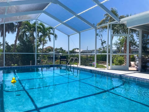 Private heated pool with a beautiful view of the canal and private dock!