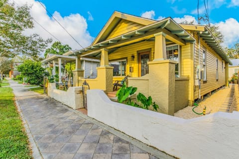 Charming 1920s shotgun style bungalow in historic Pensacola Old East Hill neighborhood with covered front porch and traditional craftsman architecture