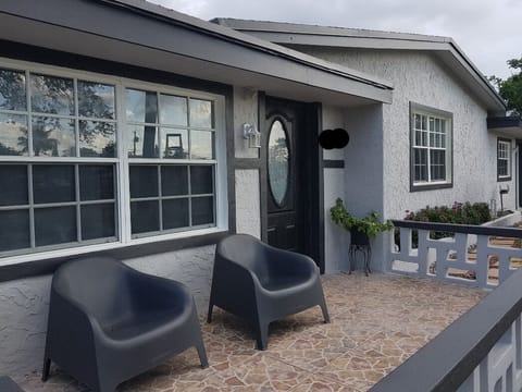 Main house Front pic. Tiny House located  Right Back Rear (follow paver walkway)