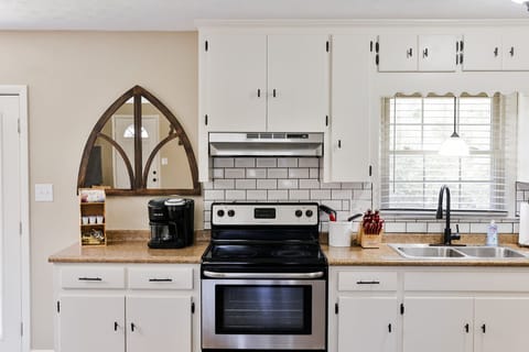 Nice painted cabinets with subway tile backsplash