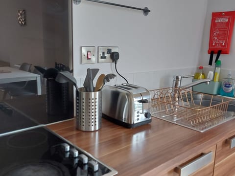 Kitchen with toaster, 4 hob electric stove, cooking appliances