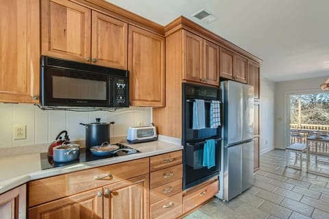 Enjoy the full kitchen with a refrigerator, freezer, oven, stove, microwave, dishwasher, coffee, creamers, mixers, spices, pots, pans, cooking supplies, cutlery, cups, plates, bowls, utensils, small appliances, and many more essentials!