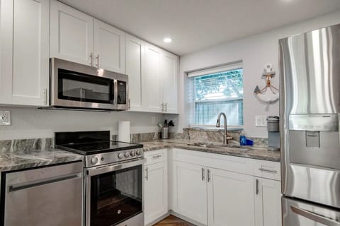Full kitchen with appliances. 