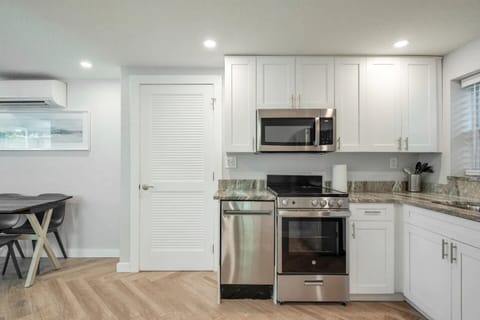 Full kitchen with appliances. 
