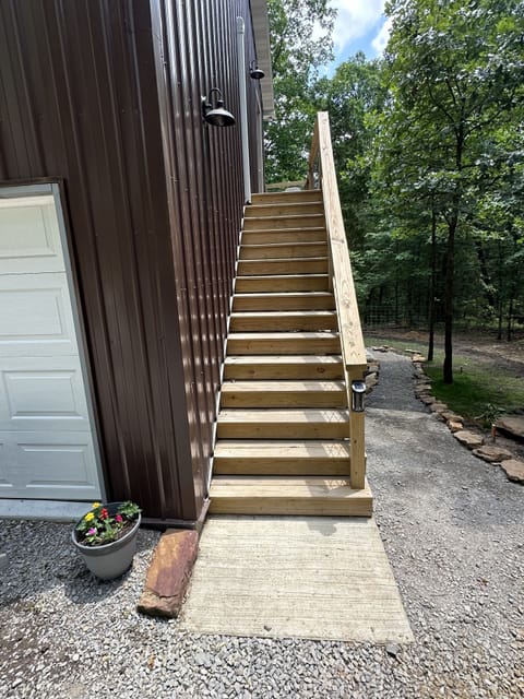 Stairs leading up to 2nd floor and spacious deck.