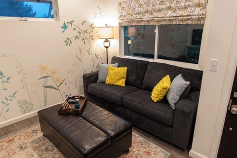 Couch turns into a queen sized bed and the ottoman turns into a twin.