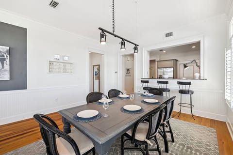 Gather around your stylish dining table for memorable meals, with an open kitchen design perfect for conversation and entertaining.