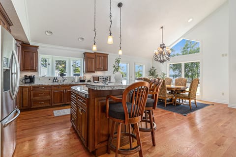 The High-Top Seating around the Island provides additional seating for the group