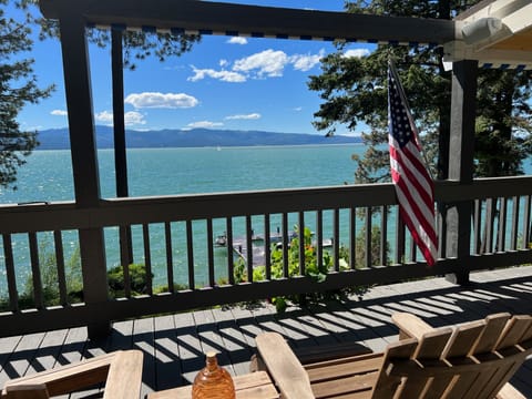Emerald colored lake in the spring sunshine.  View from the deck.