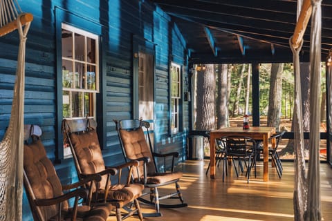 The screened in porch is the crown jewel of this cabin - enjoy the river views from the hammock or rocking chairs and dine al fresco!
