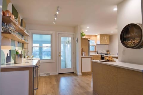 Directly next to the Lounge is our wetbar to the left, kitchen and coffee counter to the right. Keep your beverages cold in the cooler under the bar counter.