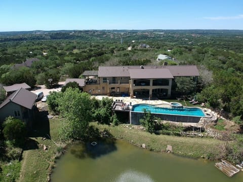 Four bedroom house, Cabin, Private heated, 20 yard lap pool, hot tub! (house 1)