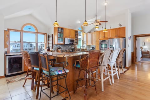 Cook up your favorite seafood feast in the Gourmet Kitchen with 2 Dishwashers, 2 Ovens, a 5-Burner Cooktop, Freestanding Ice-maker, and a Wine Cooler.