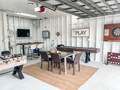 Game room with tv, scrabble, darts, JENGA, corn hole, shuffleboard, foosball