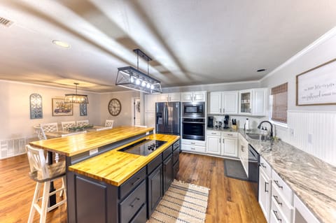 Full kitchen that opens to the dining room and living room