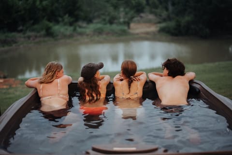 Guests relaxing in the hot tub overlooking Lake Granbury at The Blanc
