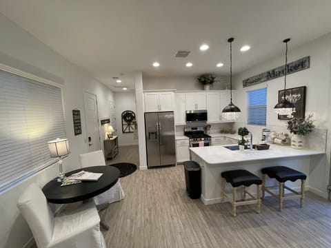 Dinning table and chairs, kitchen, island bar seating