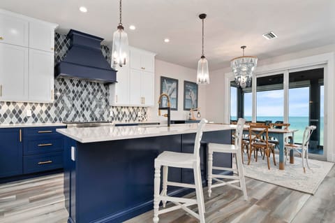 Kitchen opens to the formal dining room for 8