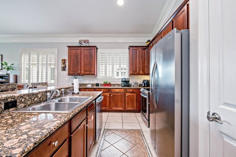 Galley part of kitchen, with bar counter, dishwasher, microwave, etc.
