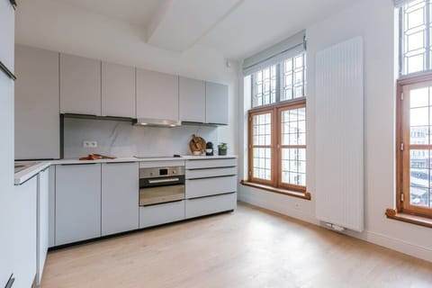 The kitchen is spacious and has plenty of natural light. It is modern and fully equipped, so you can cook up a meal whenever you want.