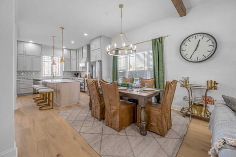 Gather around our elegant dining room table, perfect for hosting memorable meals and special occasions with loved ones during your stay."