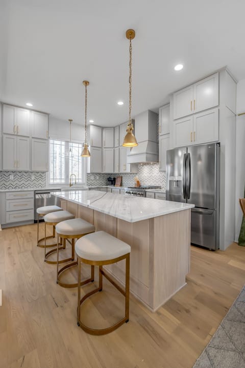 Make a grand entrance in our stunning entryway, featuring white oak floors and a warm, welcoming ambiance.