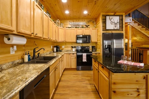 Fully stocked kitchen featuring sleek Samsung appliances makes cooking a breeze