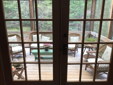 View from dining area to screened-in porch