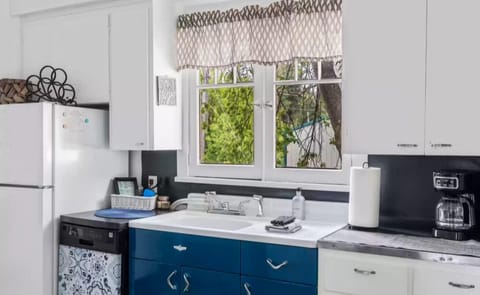 Vintage kitchen, well-equipped for meal prep.