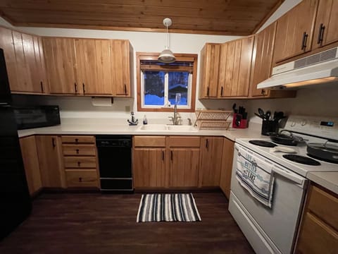 Full size kitchen with new pots and pans, dishes, and utensils