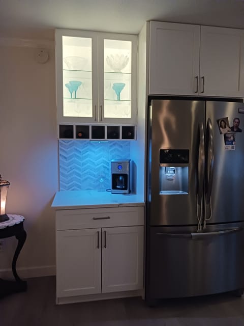 Coffee/Wine bar with integrated wine storage and accent lighting