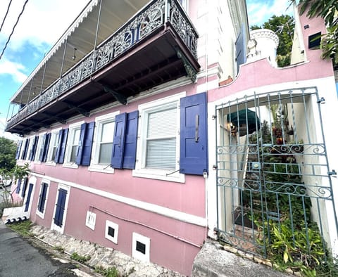 Front door is located behind this gate, to the left.