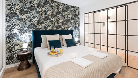 Gorgeous bedroom with sleek glass sliding doors — a stylish space that feels even more magical at night.

#nighttime #stylish #bedroomdesign #lovelystay