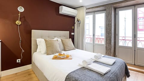 Gorgeous bedroom with exposed stone wall and a comfortable mattress #comfort #lovelystay