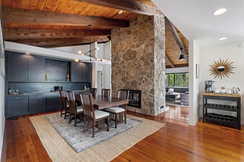 Dining room with cabinets fully stocked with serving ware.