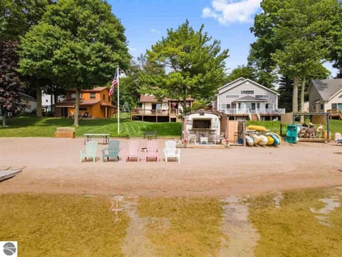 The beach has 50ft of private frontage just steps from the home, with a huge sandy beach for guests to enjoy. It also has a fun Tiki Hut with bar seating, a refrigerator, and more.