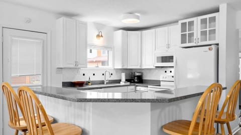 The kitchen is stocked with all the essential cooking equipment & dishes you'll need to gather all your guests at The Beach House.