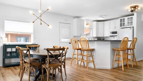 Walking through to the back of the home, you'll find a large open concept living area, featuring the kitchen, dining area, and second living room.