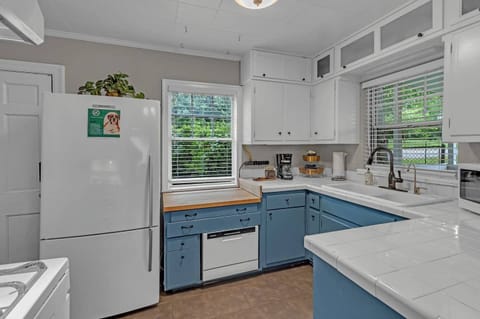 The kitchen is equipped with standard cooking ware and appiances.