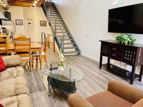 Living room connected to dining area.
There are gaps between steps of the stair 