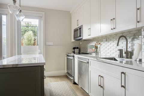 Fully-equipped kitchen with brand new stainless appliances - electric range, microwave, french door refrigerator w/ filtered water, dishwasher, drip & Nespresso coffee makers, toaster, pots + cooking staples (spices + oils, etc.)