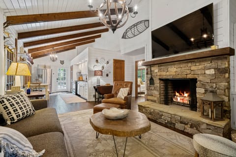 Living room with wood burning fire place