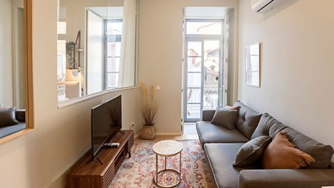 Living room with sofa-bed for 2 and AC unit for a comfortable stay! #AC #cozy